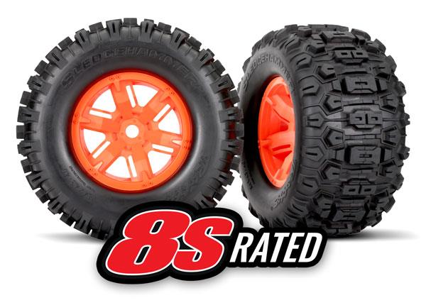 Traxxas Tires & wheels assembled glued (X-Maxx® orange wheels Sledgehammer® tires foam inserts) (left & right) (2)