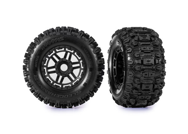 Traxxas Tires & wheels, assembled, glued (black wheels, BELTED Sledgehammer® All-Terrain tires, dual profile (2.9" outer, 3.8" inner), foam inserts) (2) (17mm splined) (TSM® rated)